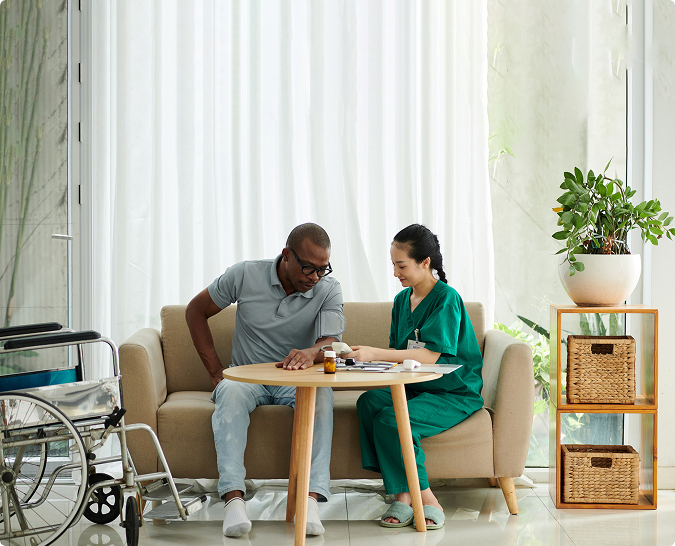 social-worker-checking-blood-pressure-patient-with-disability